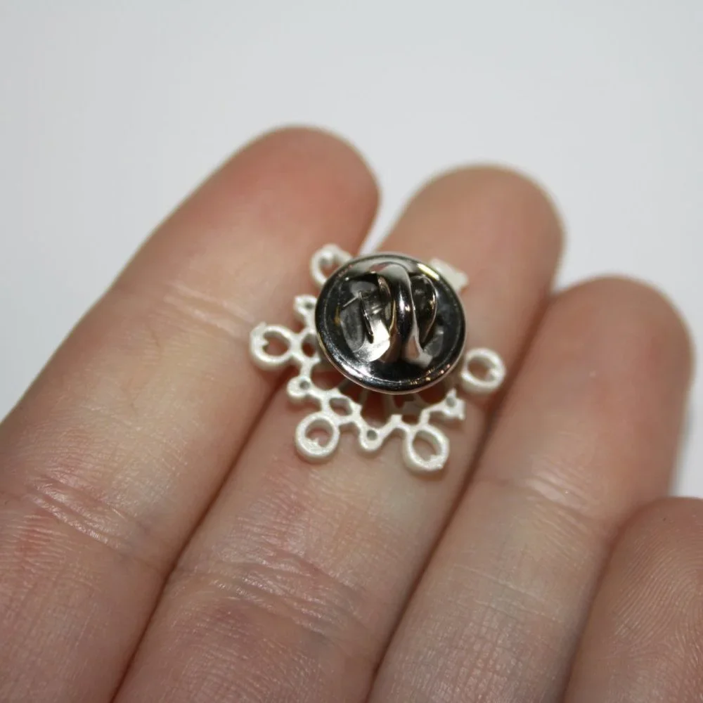 Beautiful white snowflake lapel pin .75